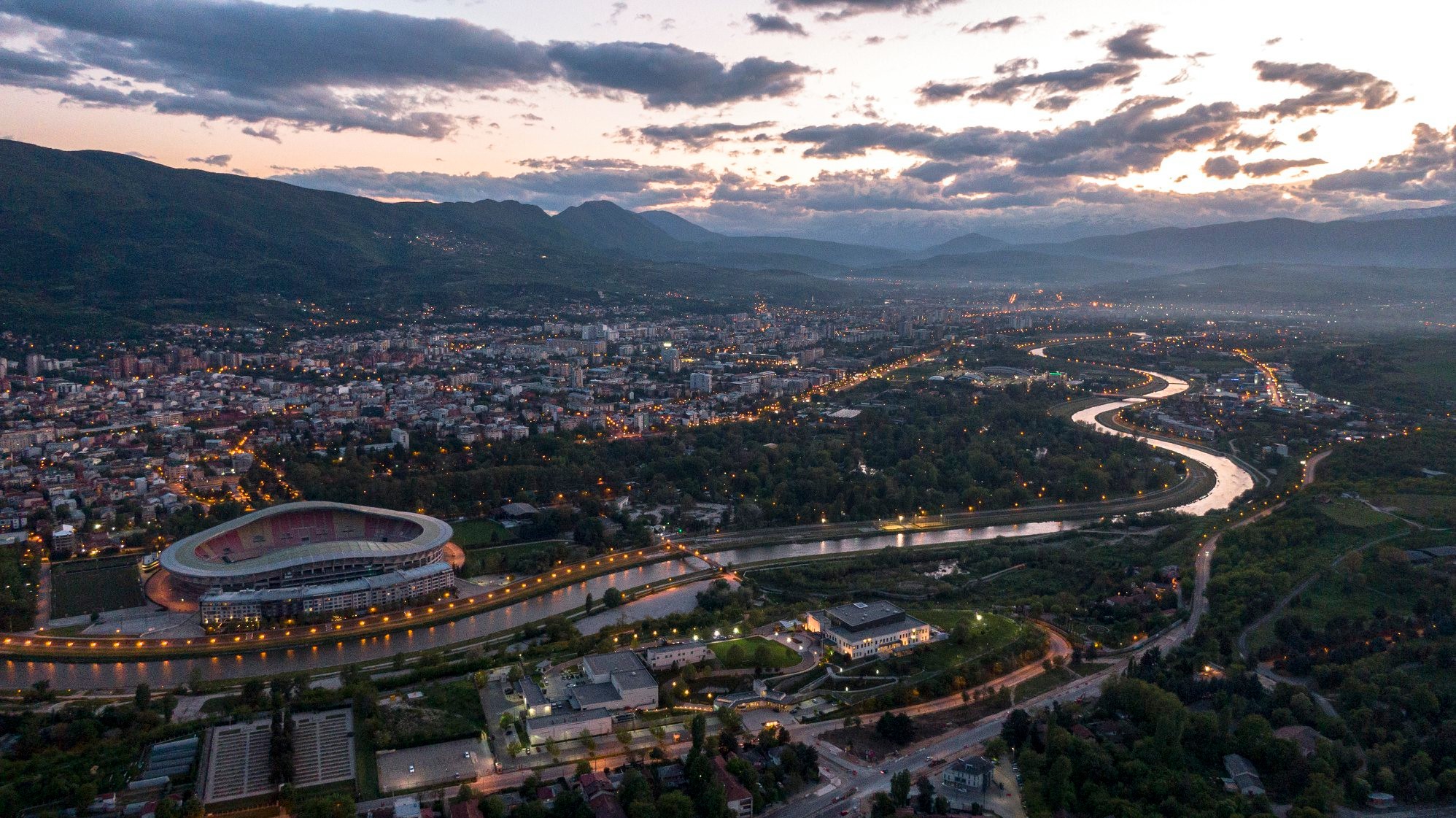 Aerial view of Skopje at dusk with city lights